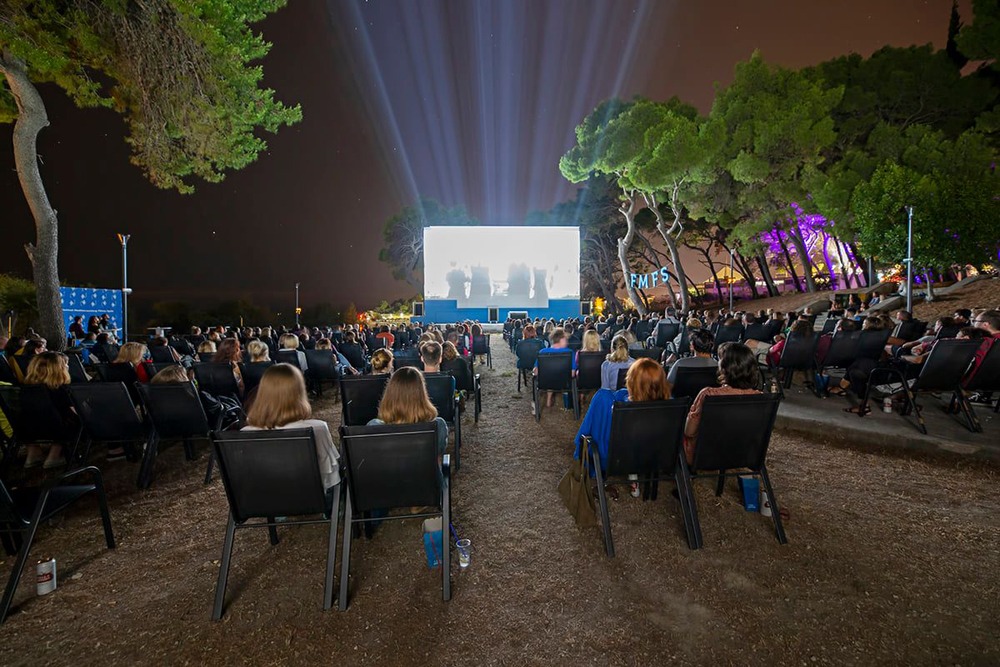 Camp Meteor's outdoor music festival, featuring live performances and an energetic crowd