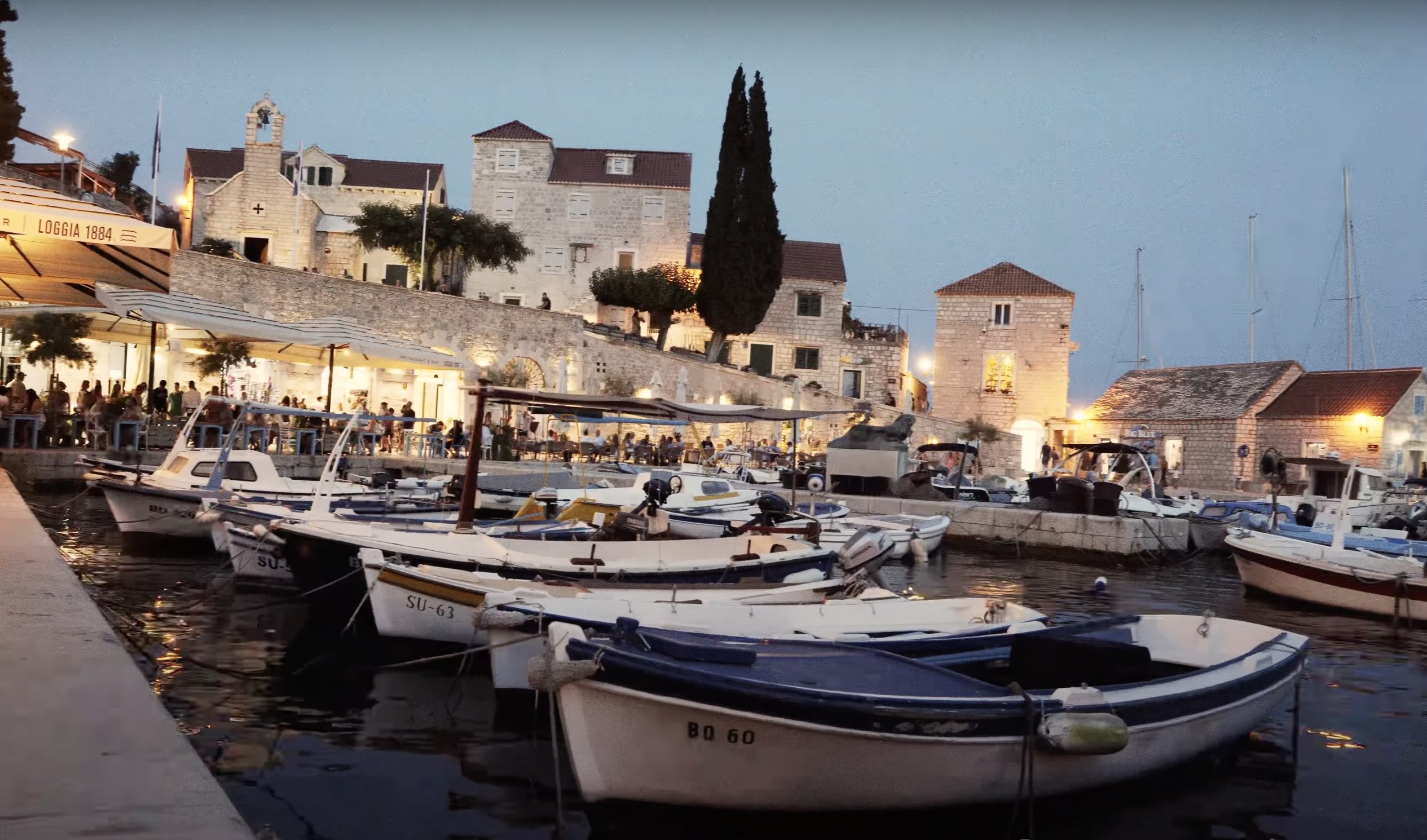 Charming narrow streets and stone buildings in the old town of Bol, Brač, Croatia