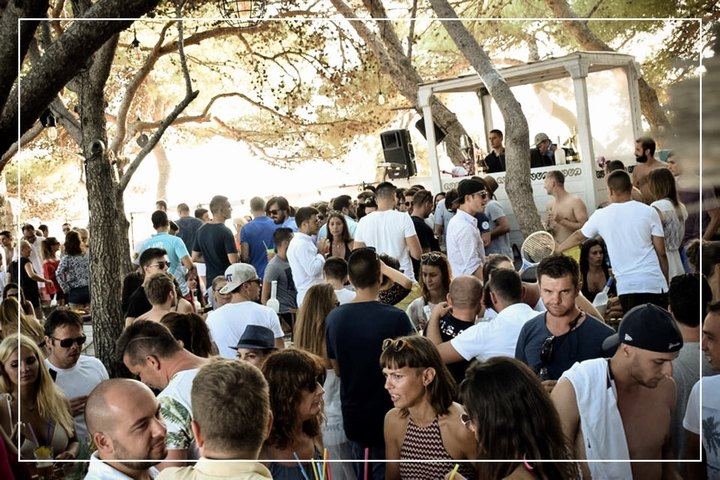 Crowded Outdoor Festival with People Enjoying Live Music